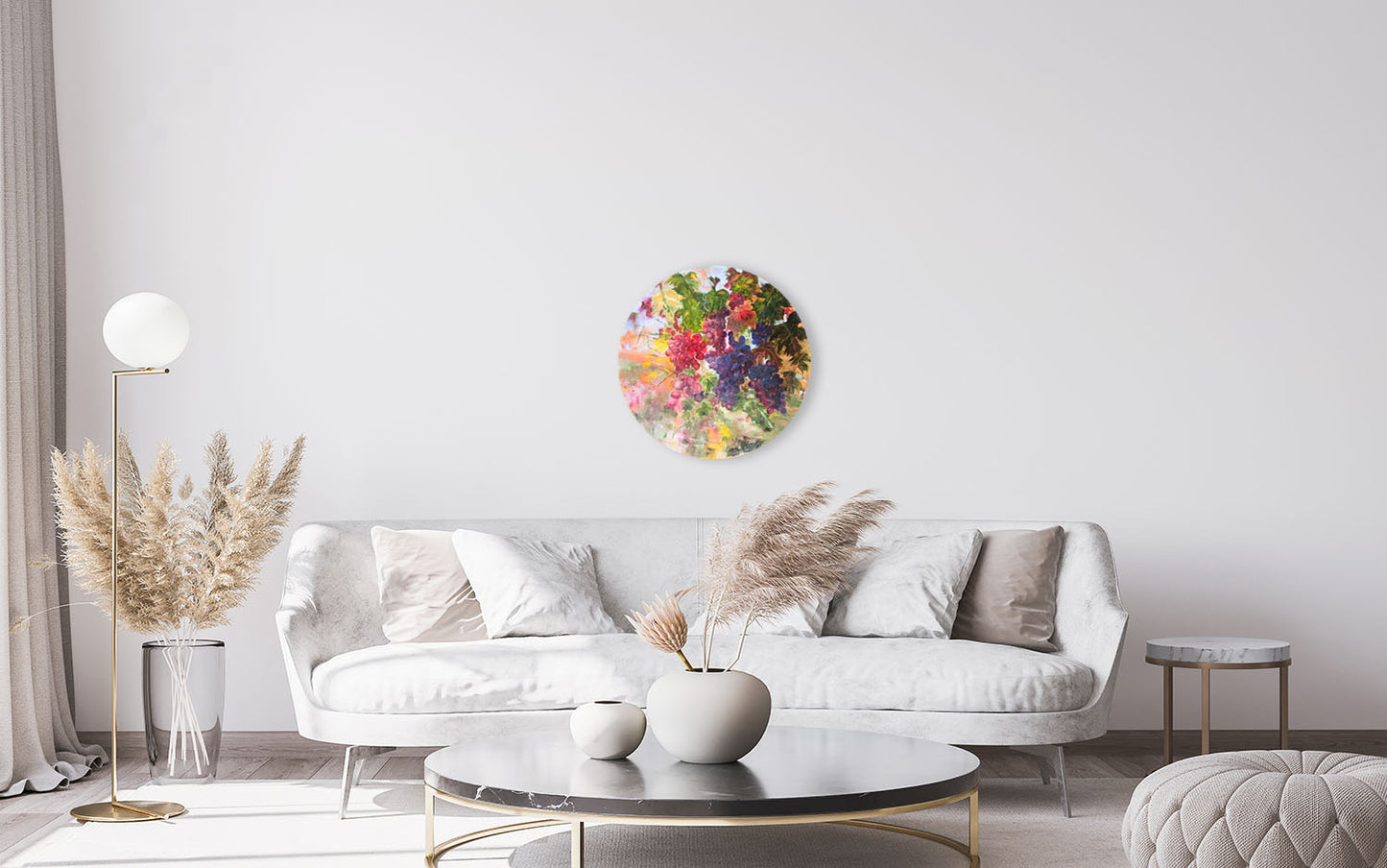 Modern living room with a white sofa, decorative plants, and a colorful floral wall art piece.