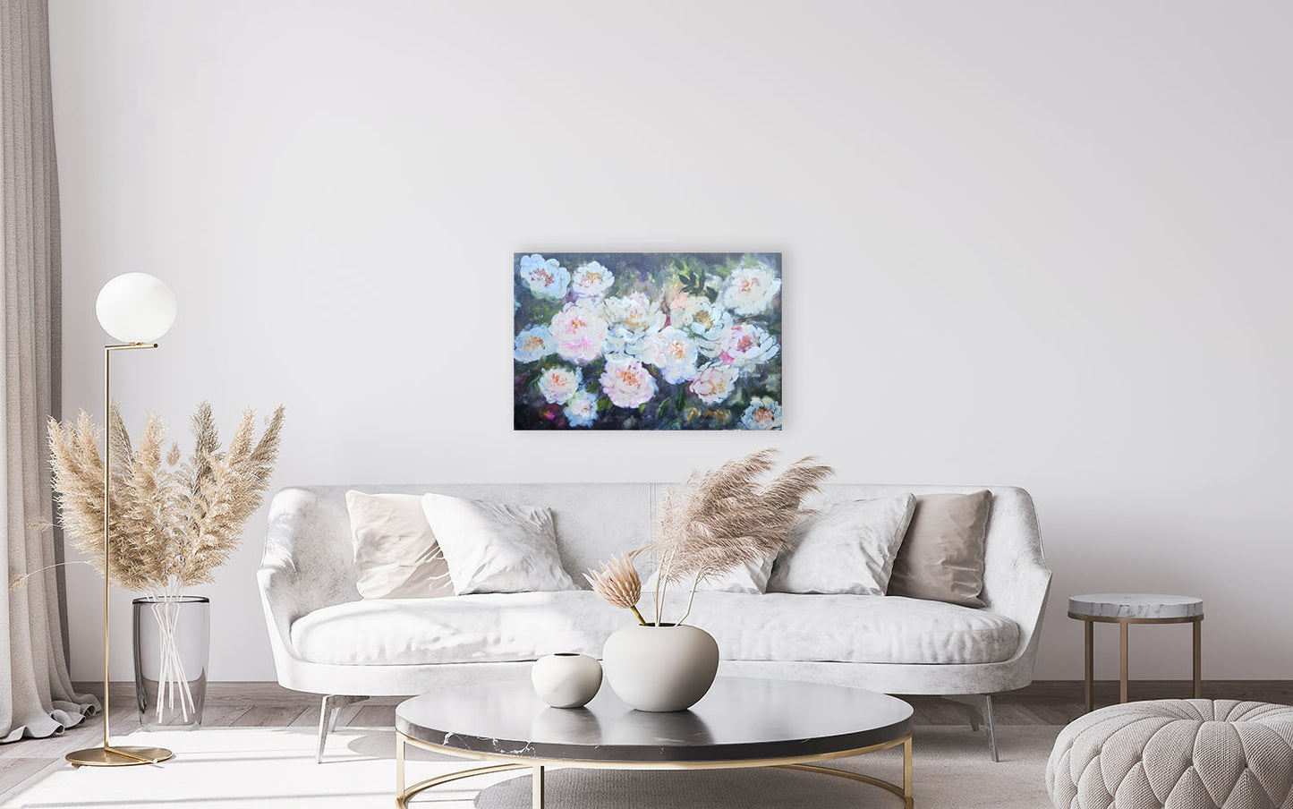 Modern living room with a white sofa, coffee table, and decorative elements and christina maassen art original artwork.