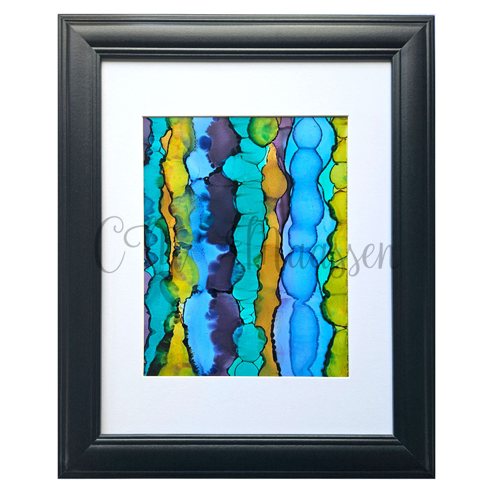 Framed abstract artwork with blue and yellow patterns on a white background