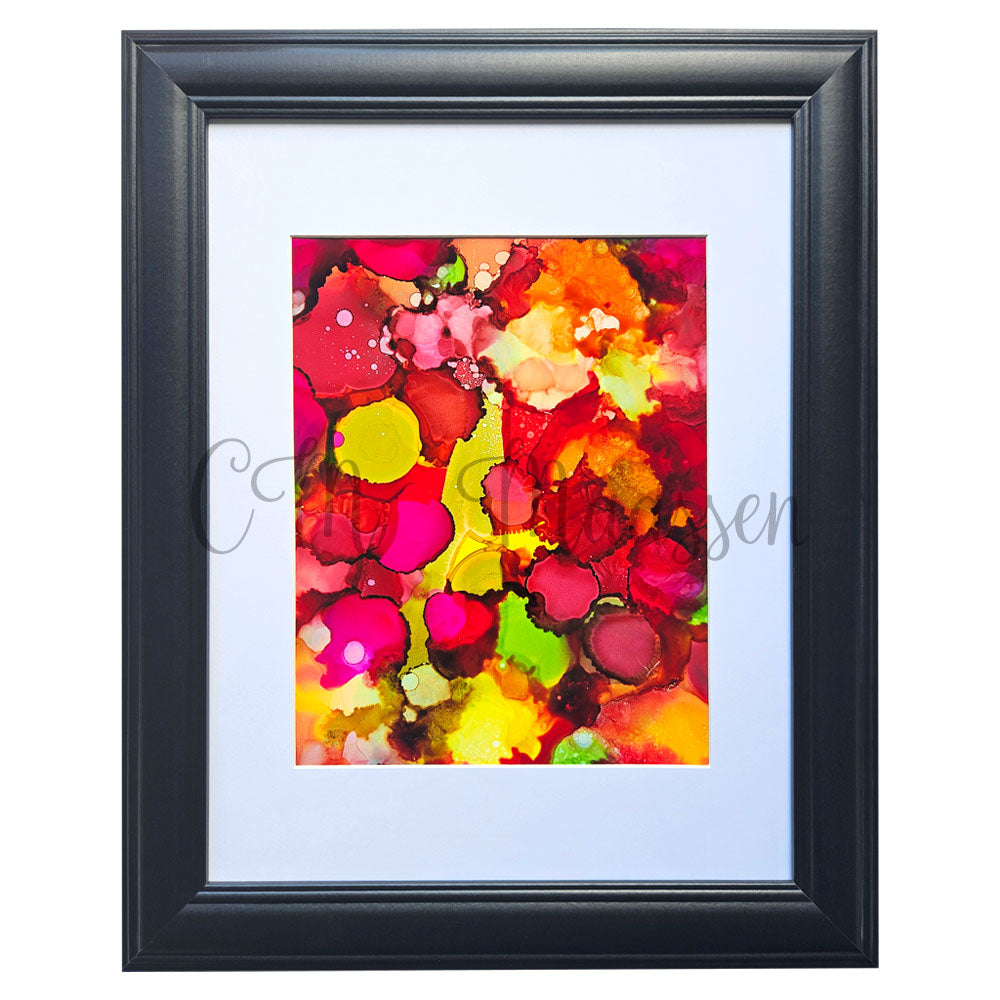 Framed abstract artwork with vibrant colors on a white background