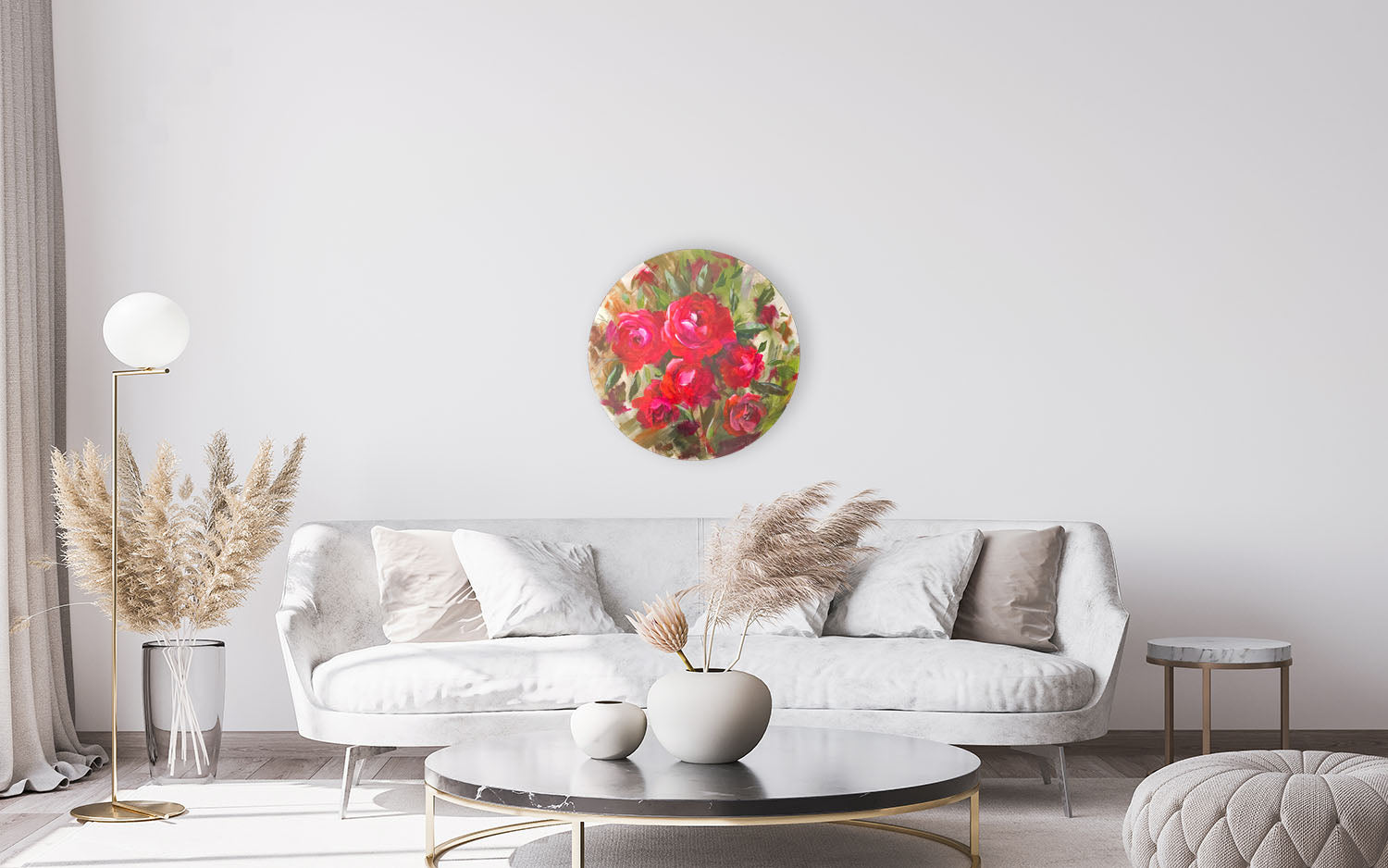 Floral artwork on a wall above a white sofa in a modern living room.