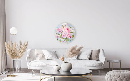 Living room with a floral wall art piece above a white sofa.