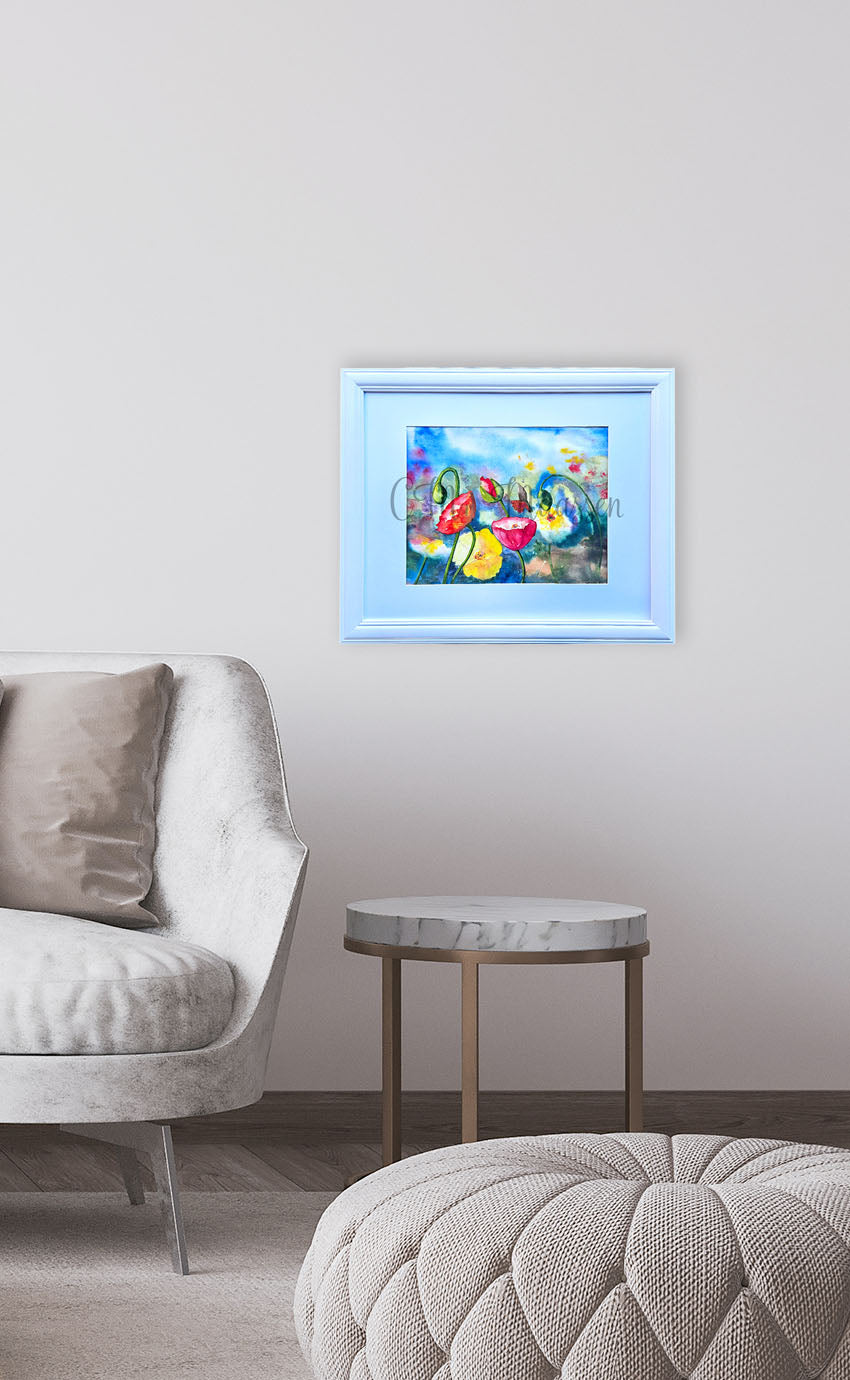 Framed Poppy artwork on a wall above a sofa in a living room