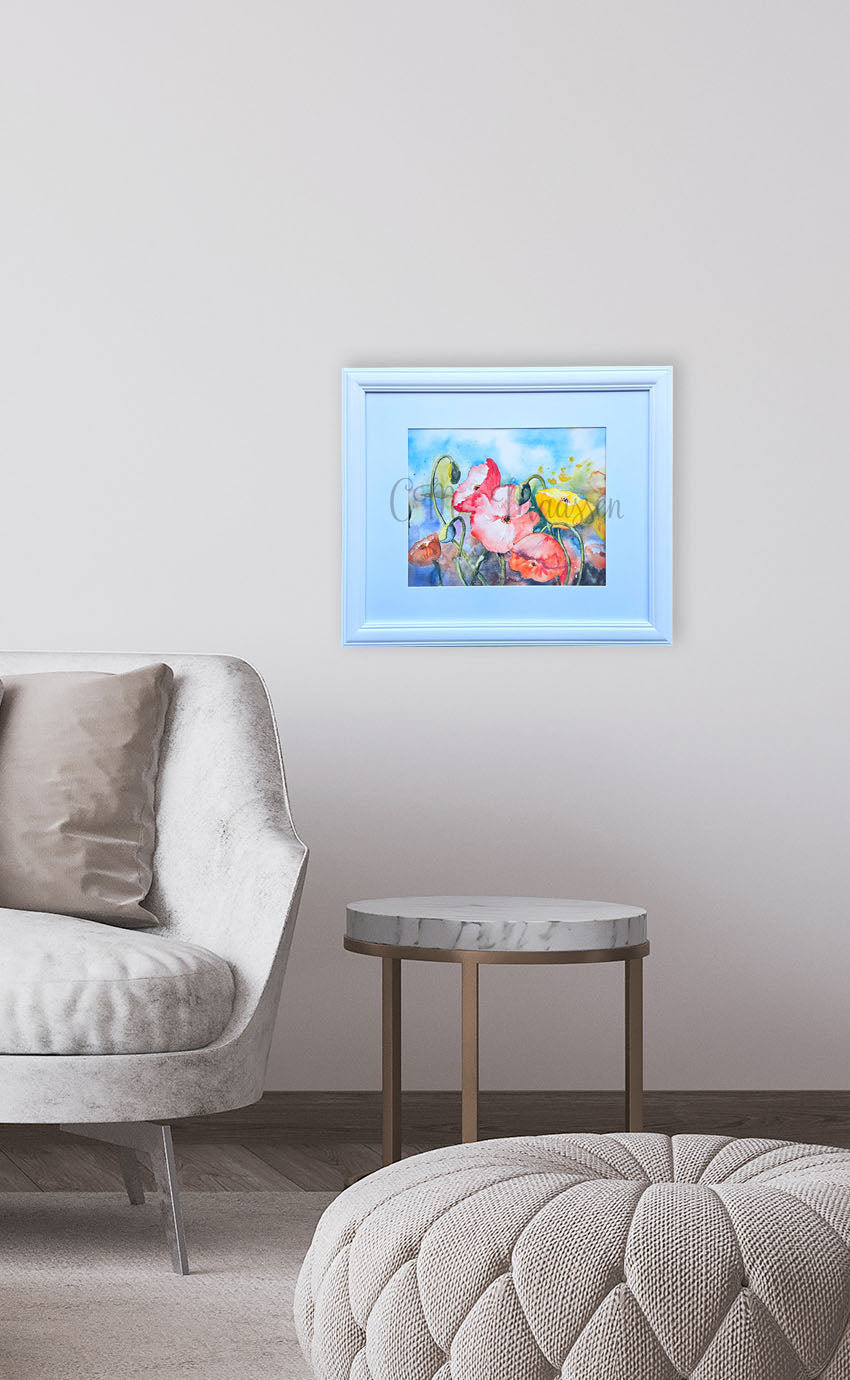 Framed poppy artwork on a wall above a sofa in a living room