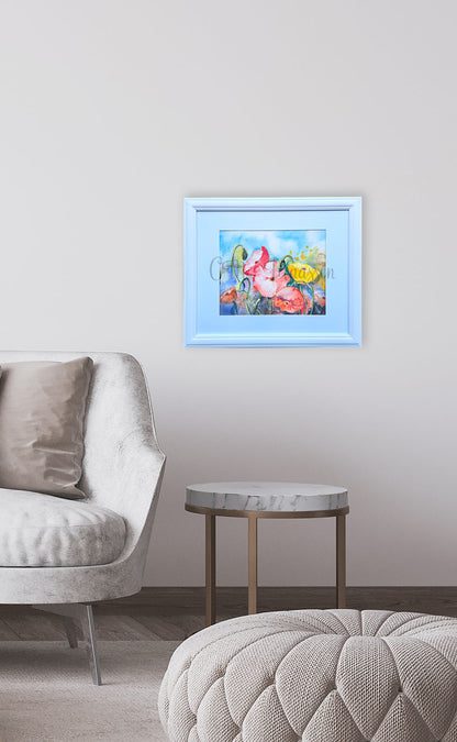 Framed poppy artwork on a wall above a sofa in a living room